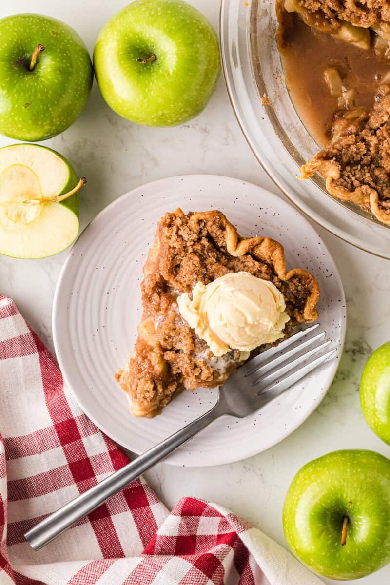 top-down view of a slice of the Dutch Apple Pie served with Vanilla ice cream.