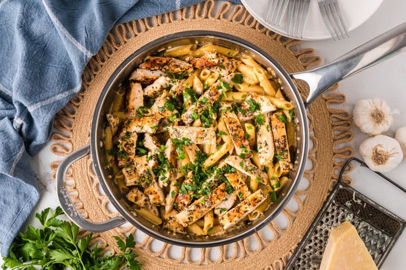 top-down view of the garlic parmesan chicken pasta in a skillet.