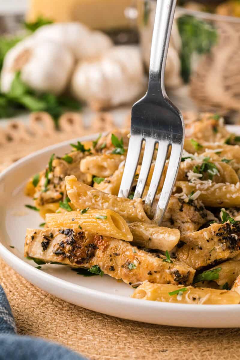 eating the pasta with a fork.