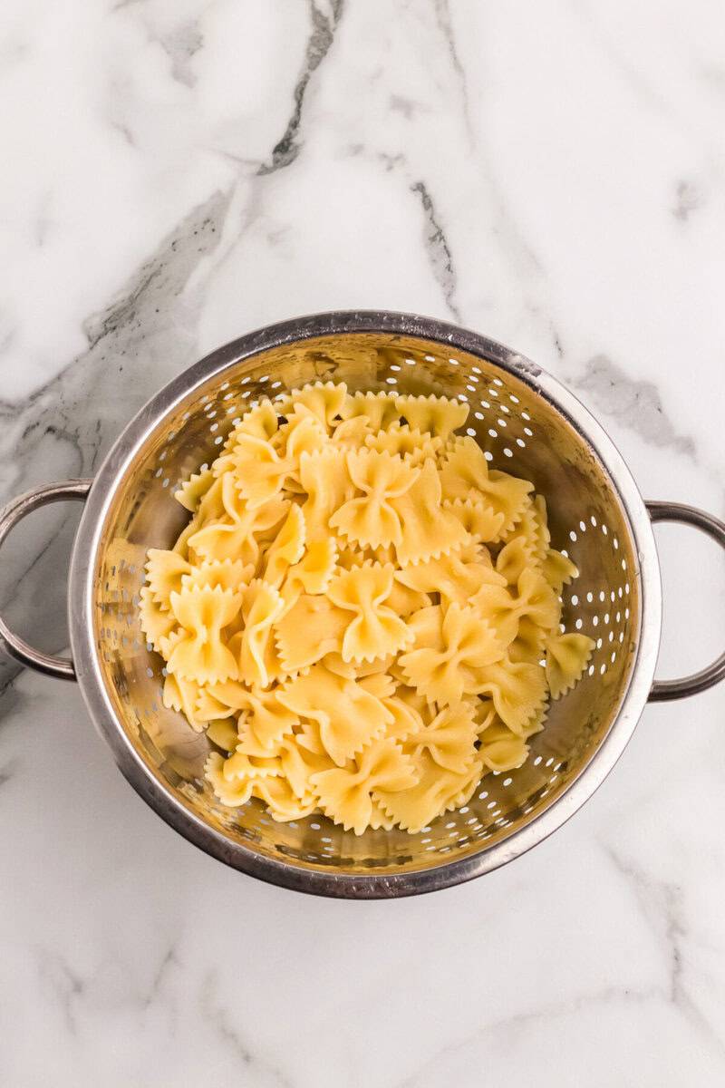 bow-tie pasta in a collander.