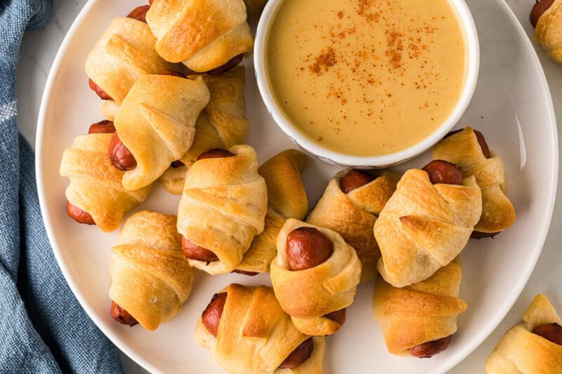 top-down view of the Pigs in a Blanket with the Honey Mustard.