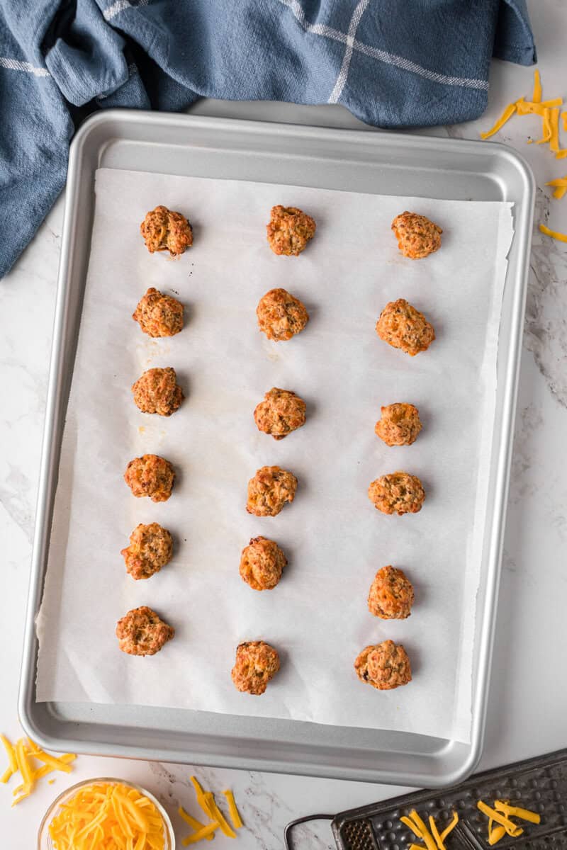 sausage balls baked on the baking sheet.