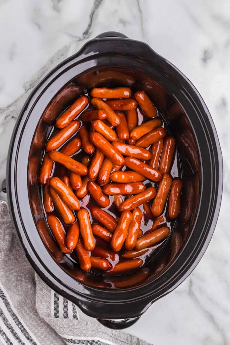 top-down view of the little smokies in the slow cooker.