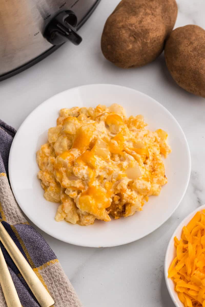 serving of the Cheesy Potato Casserole on a white plate.