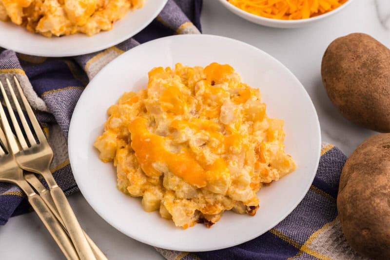 Cheesy Potato Casserole served on a white plate.