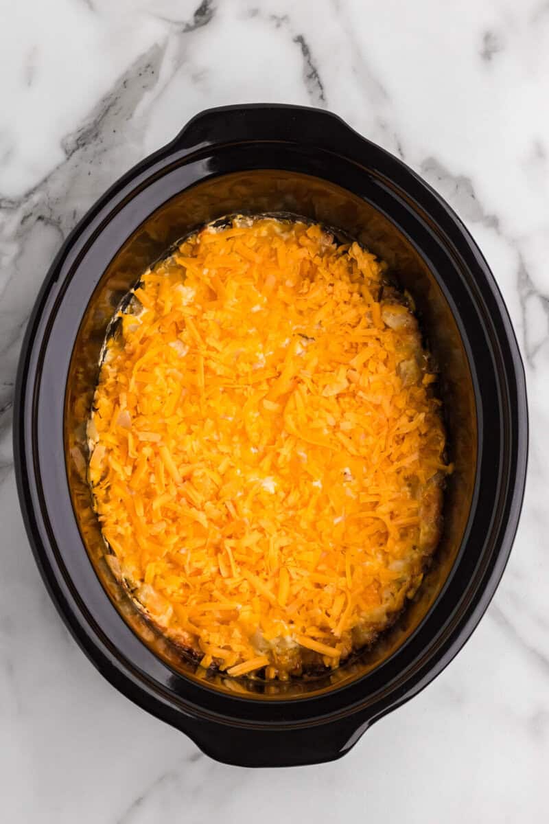 cheddar cheese topped on top of the cheesy potato casserole.