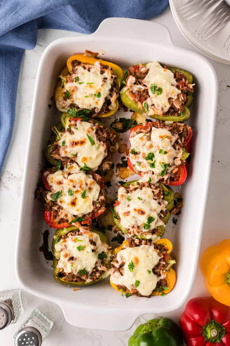 finished Stuffed Peppers baked in a white baking dish.