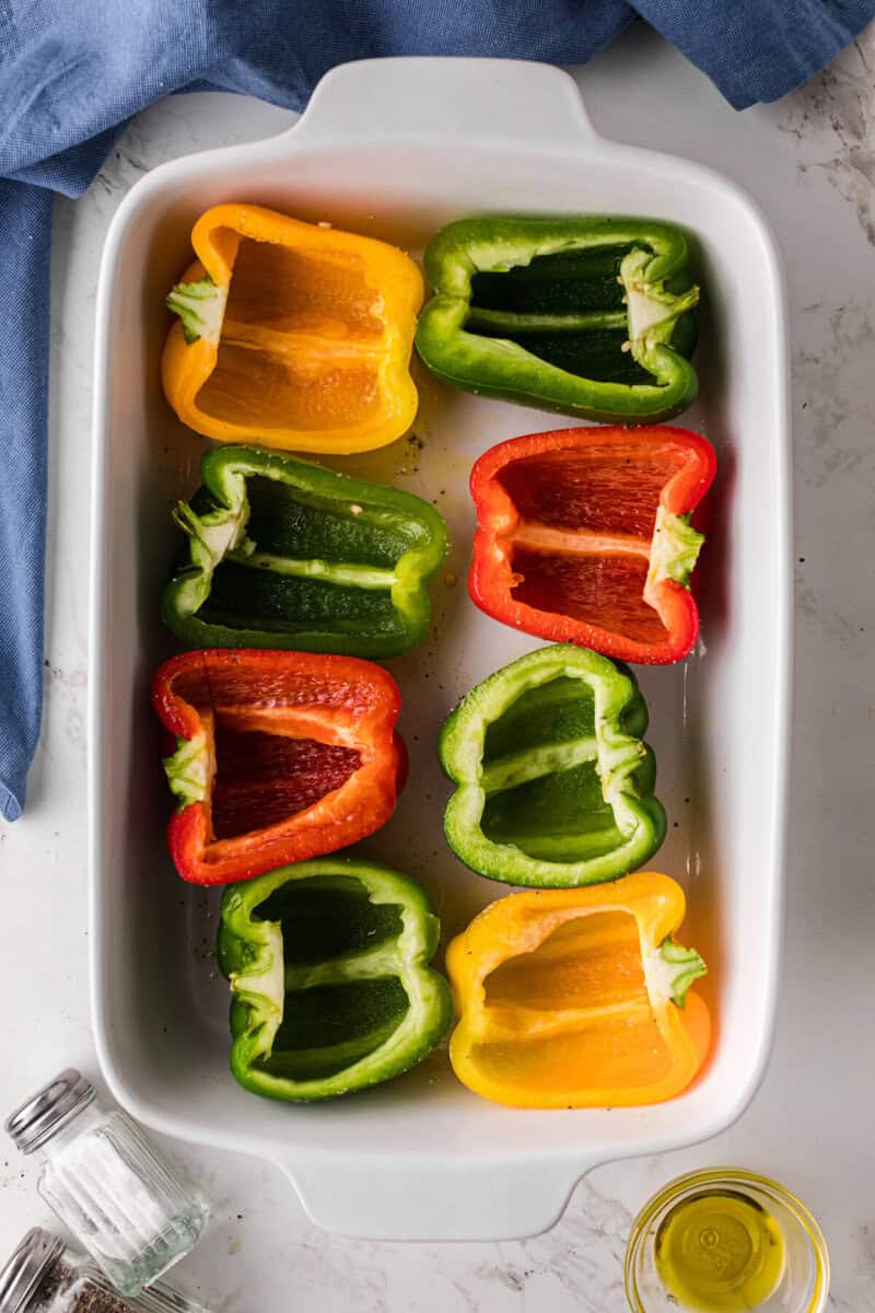 peppers cut in half in the casserole dish.