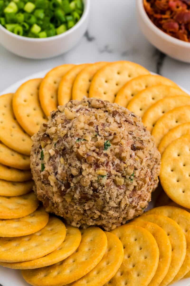 Bacon Ranch Cheeseball closeup surrounded by Ritz crackers.