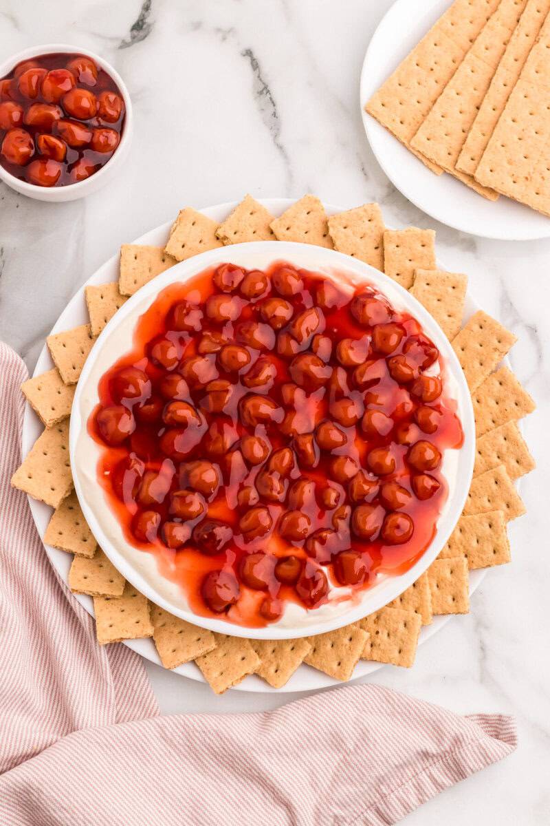 Cherry Cheesecake Dip arranged with graham crackers around it.