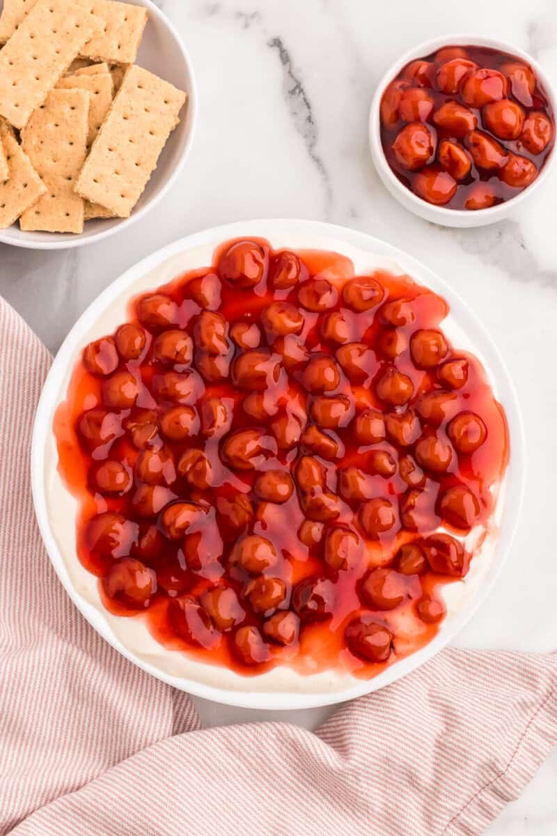Cherry Cheesecake Dip served on a white plate.