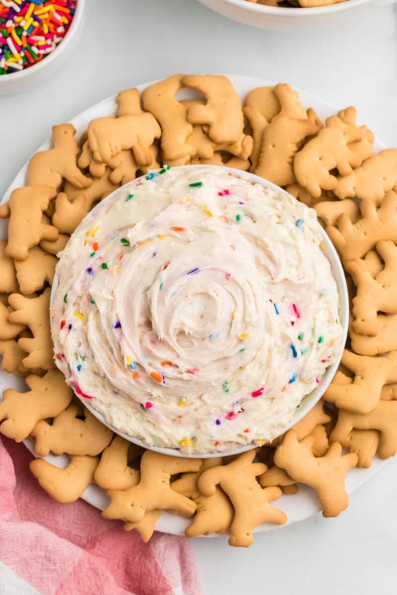 closeup top-down view of the Funfetti Dip surrounded by animal crackers.