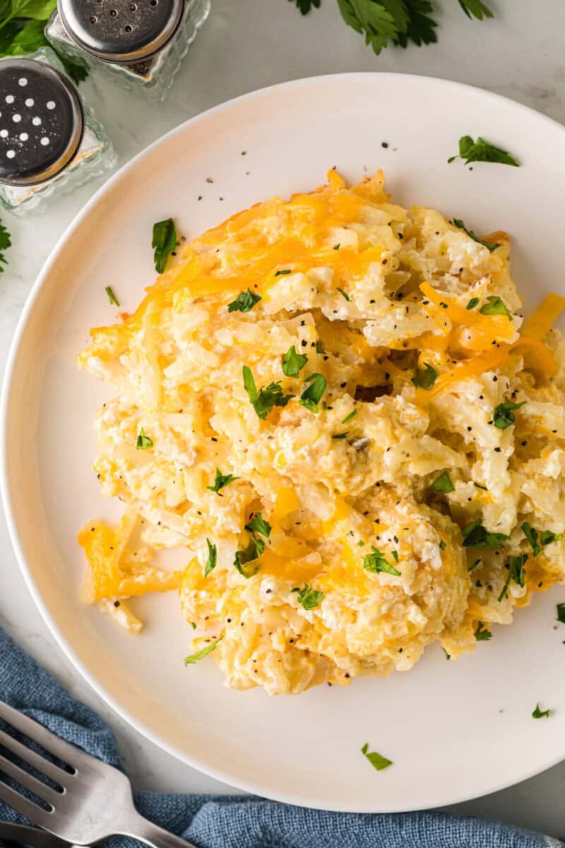 top-down view of the hashbrown casserole served on a white plate.