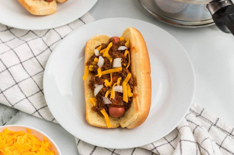 top-down view of a hotdog with Chili on top.