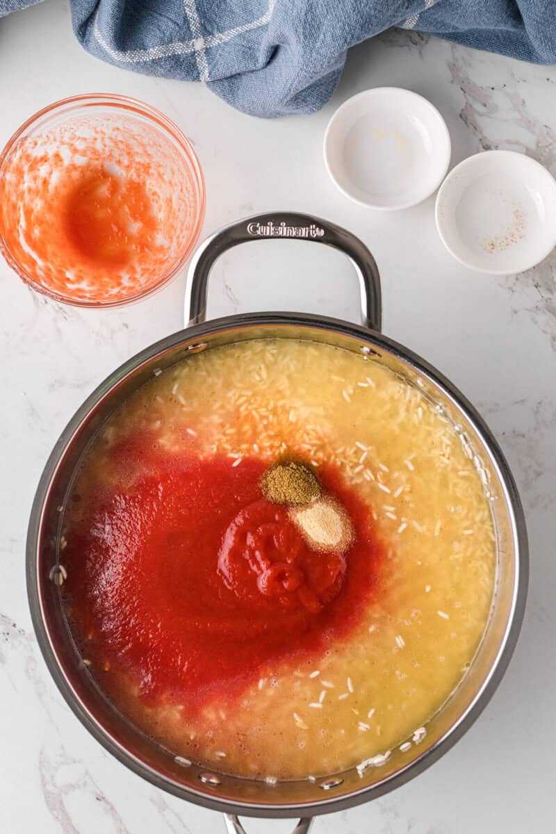 adding the other ingredients to the toasted rice before boiling it.