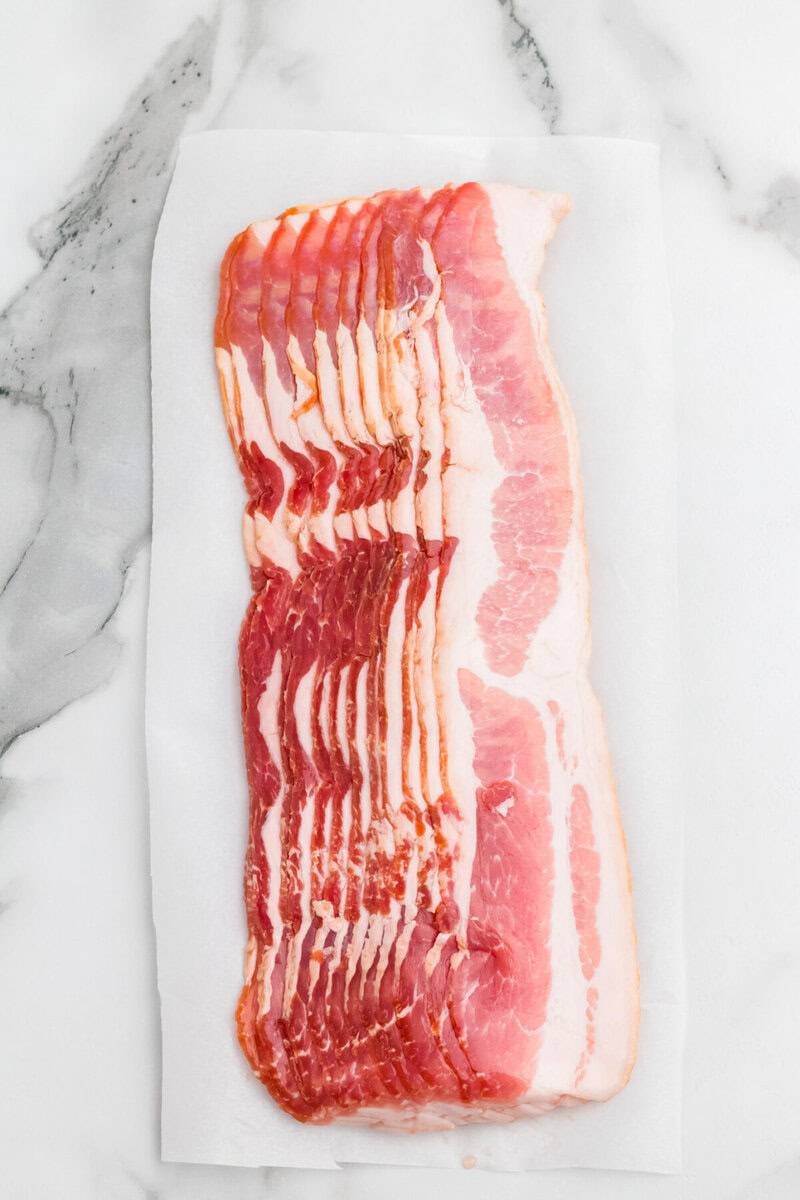 raw bacon ready to be cooked.