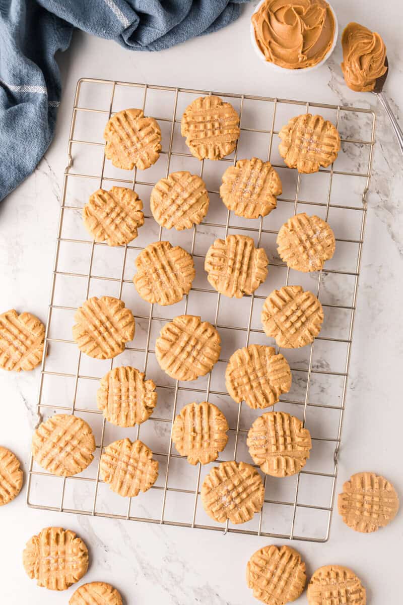 peanut butter cookies cooling on a wire rack.