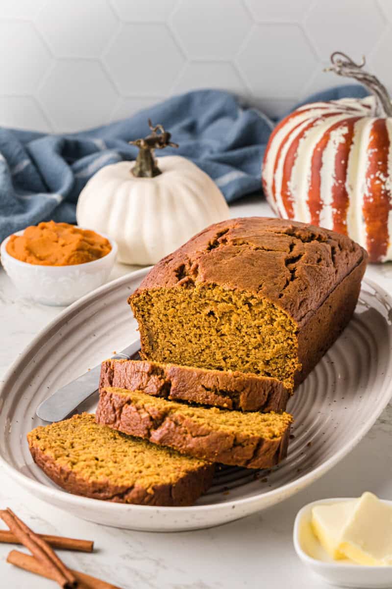 pumpkin bread sliced on a plate.