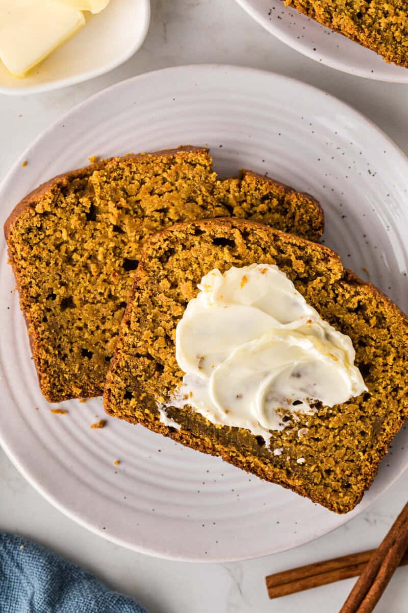 two slices of the Pumpkin bread with butter.