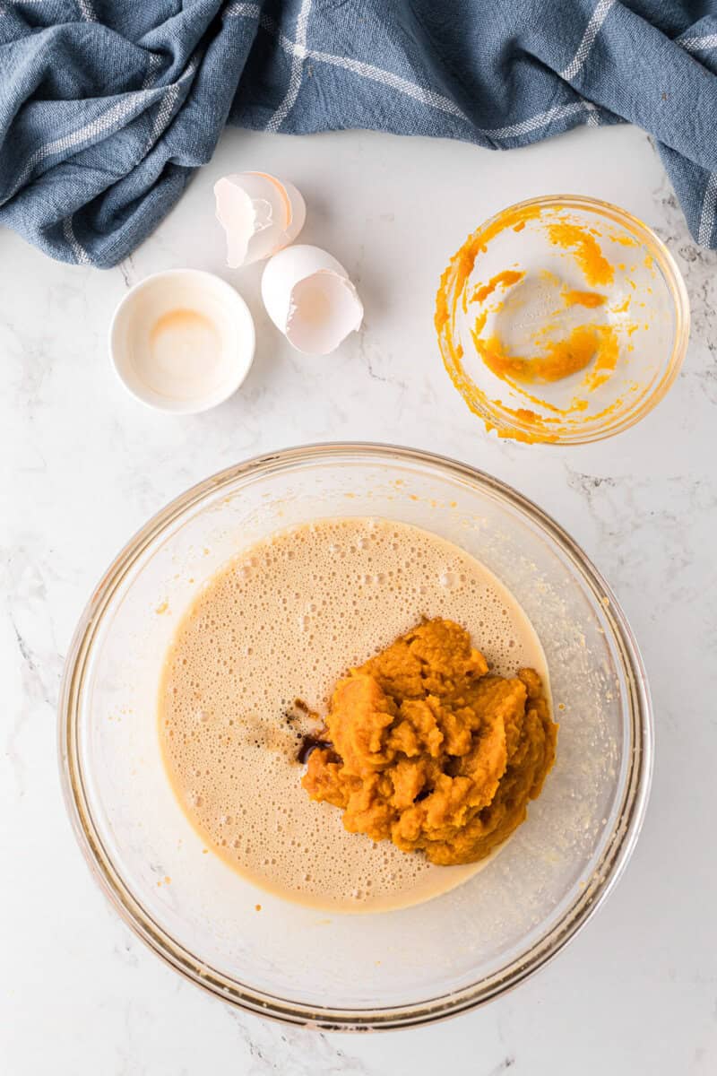 mixing together the wet ingredients for the pumpkin bread.