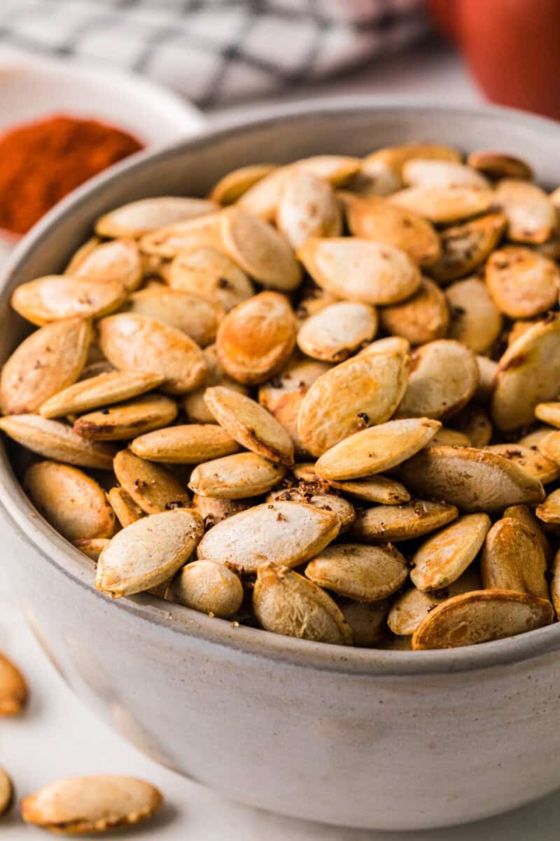 closeup of the roasted pumpkin seeds in a bowl.
