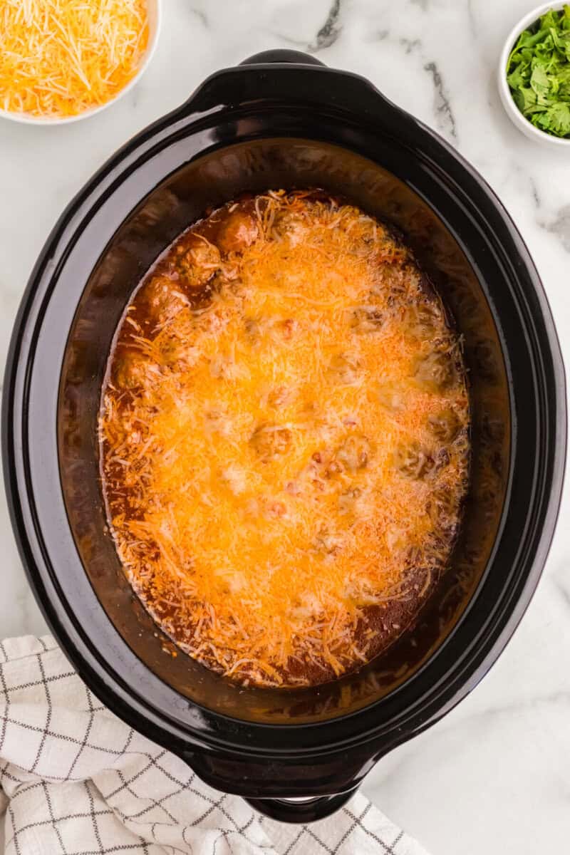 top-down view of the cheese melted on top of the enchiladas.
