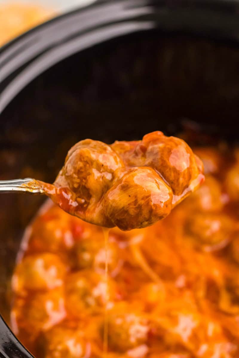 serving the enchilada meatballs out of the slow cooker.