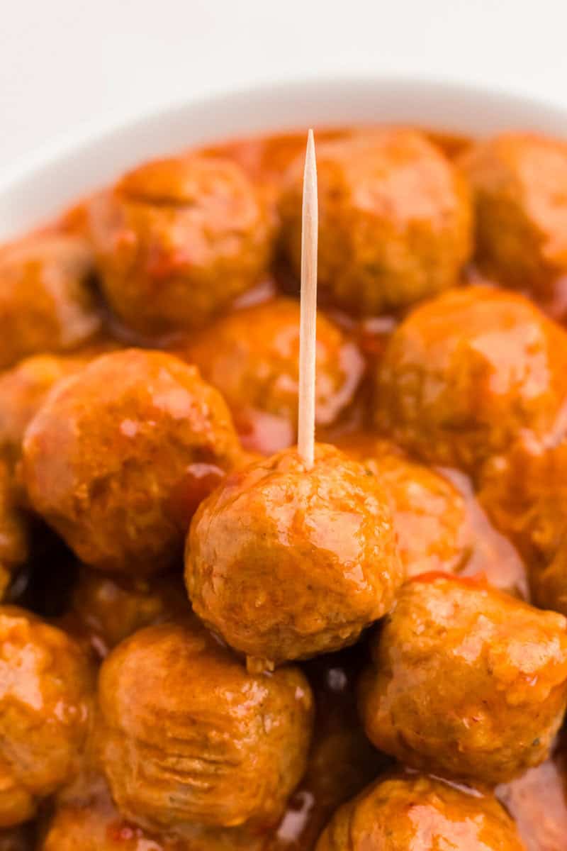 closeup of the meatballs being served with a toothpick.