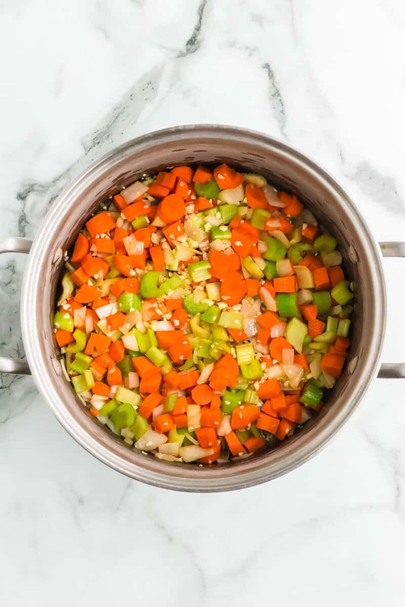 top-down view of the vegetables in the pot for the soup.