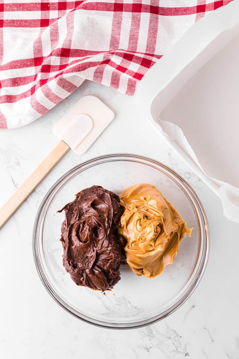 frosting and peanut butter in a large glass bowl.