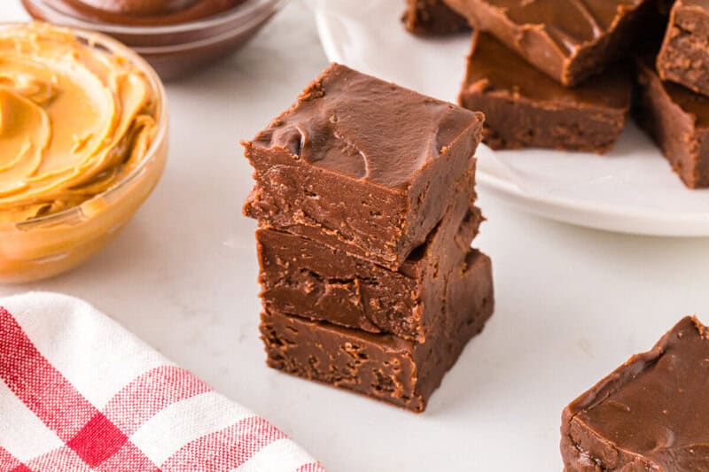 3 pieces of the 2 Ingredient Fudge stacked on top of each other.