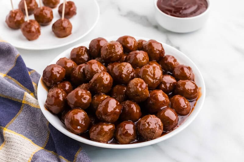BBQ Meatballs made in the slow cooker on a white serving plate.