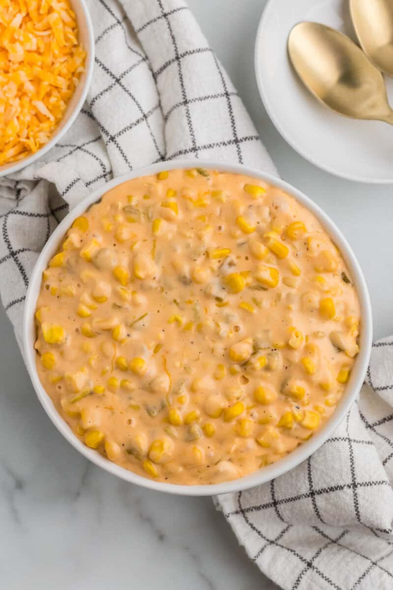 top-down view of the Cheesy Corn in a white bowl.