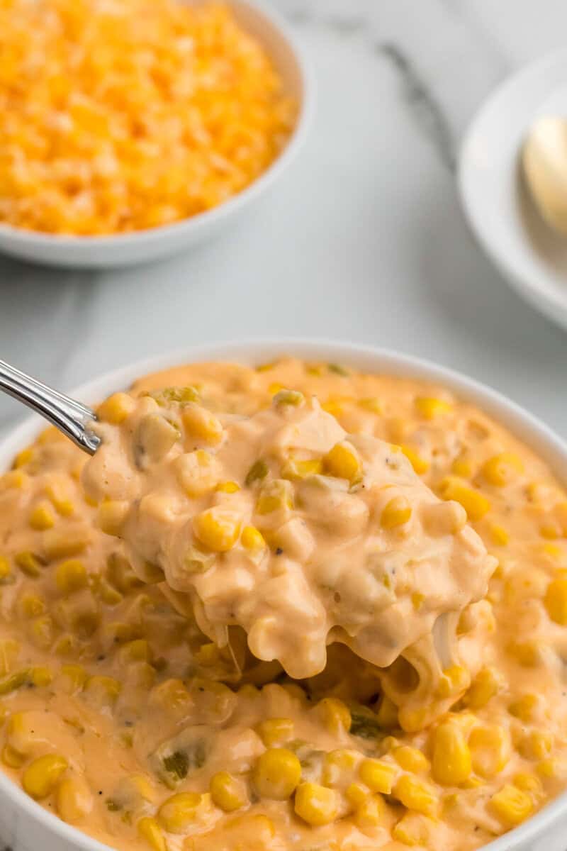 closeup of the Cheesy Corn in a white bowl.