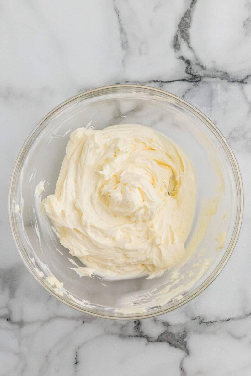 ingredients mixed for the cheese ball in a glass bowl.