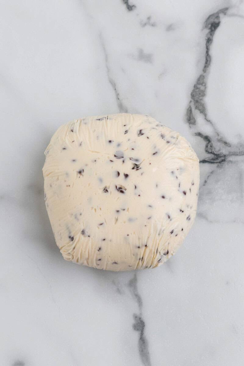 cheese ball wrapped in plastic wrap to chill.