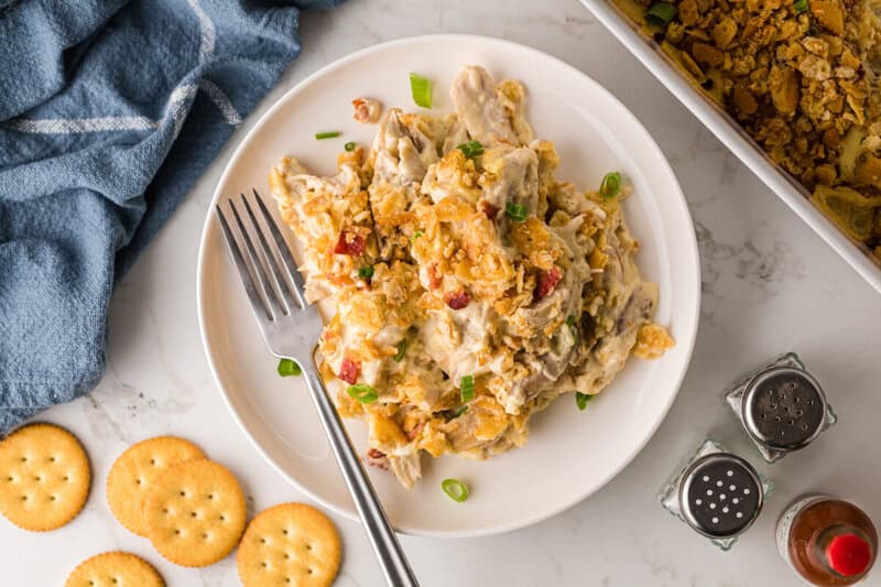 top-down view of the Million Dollar Chicken Casserole served on a white plate.