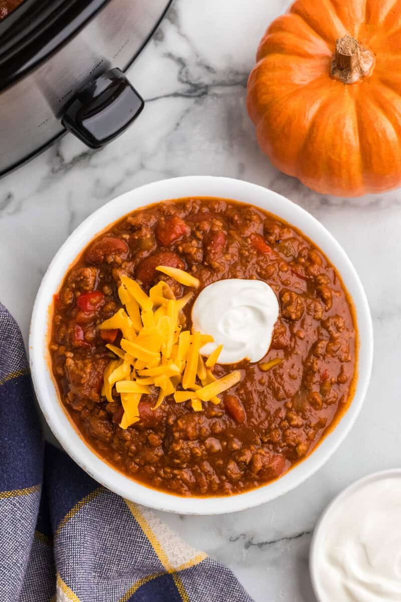 top-down view of the pumpkin chili served in a white bowl.