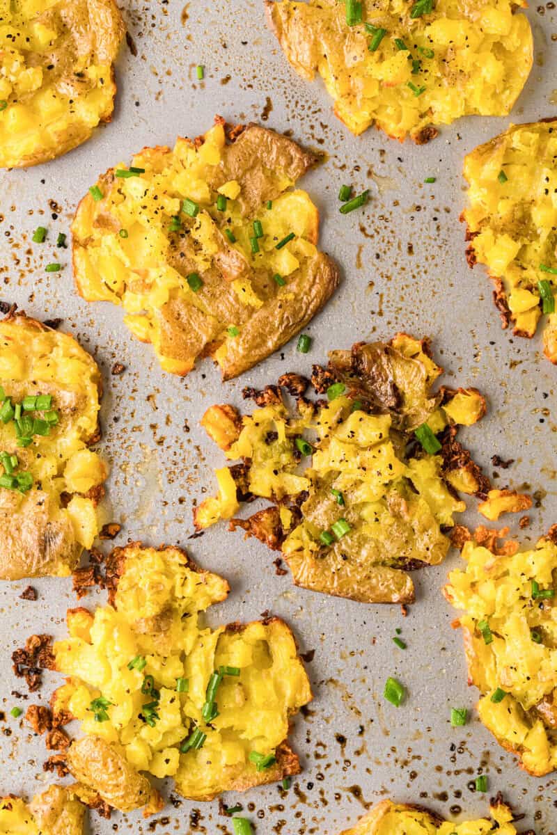 closeup of the smashed potatoes on the baking sheet.
