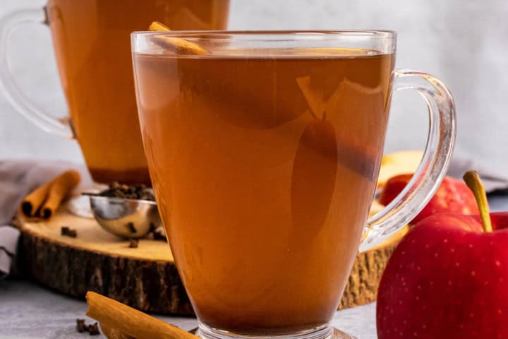 Slow Cooker Apple Cider in two mugs.
