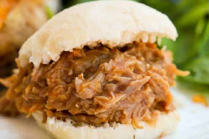 closeup of a Slow Cooker Pulled Pork Sandwich.