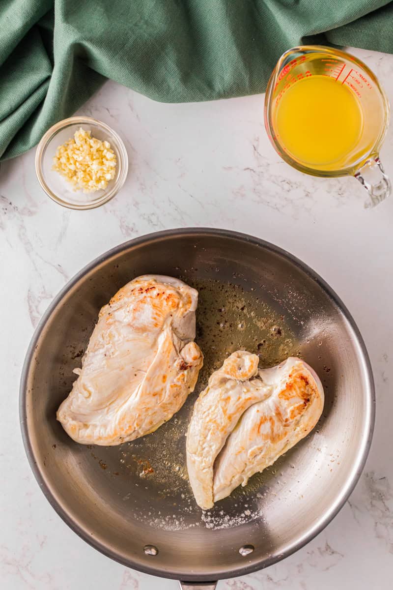 cooking the chicken the skillet.