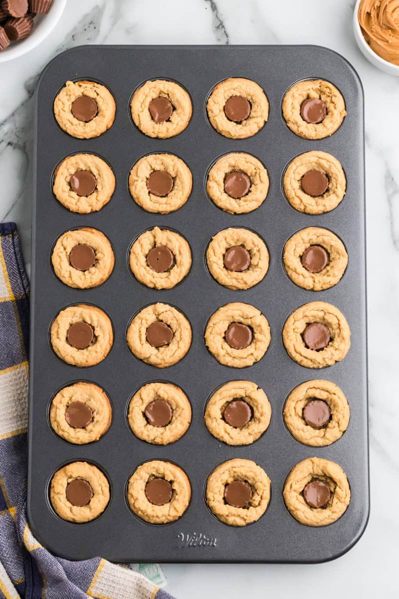 adding the peanut butter cups into the cookies.