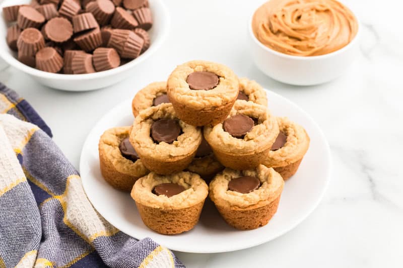Peanut Butter Cup Cookies stacked on a white plate.