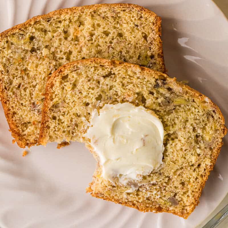 bread sliced with butter on top and bite taken from one slice