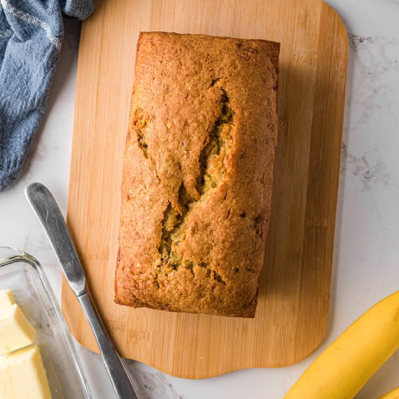 bread cooked and sat on a cutting board