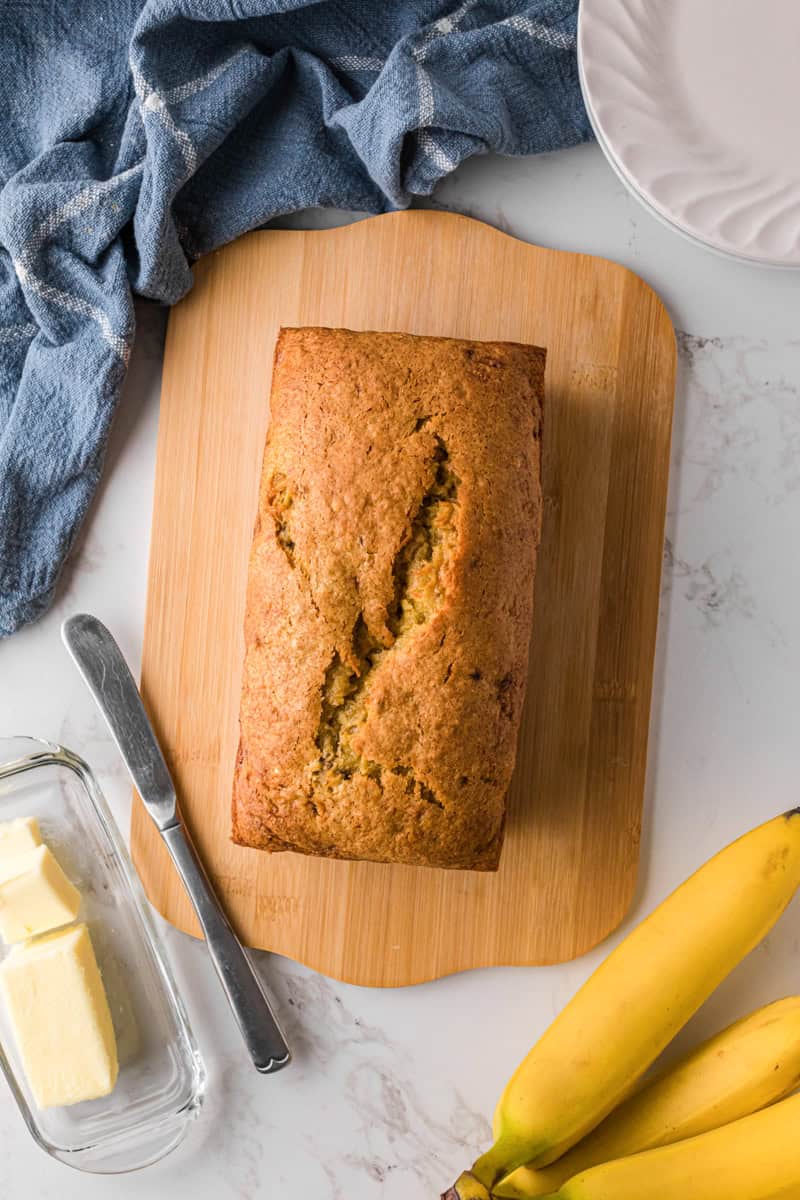 top-down view of the Banana Bread on a wooden cutting board.