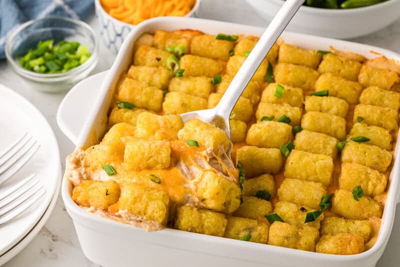 closeup of the casserole being served out of the baking dish.
