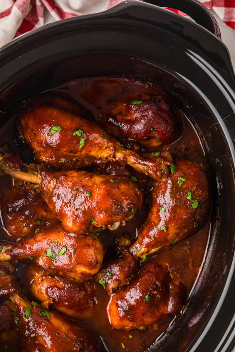 top-down closeup of the BBQ Chicken Legs in the slow cooker.