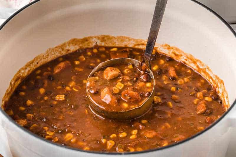 Chicken Taco Soup being served out of the pot.